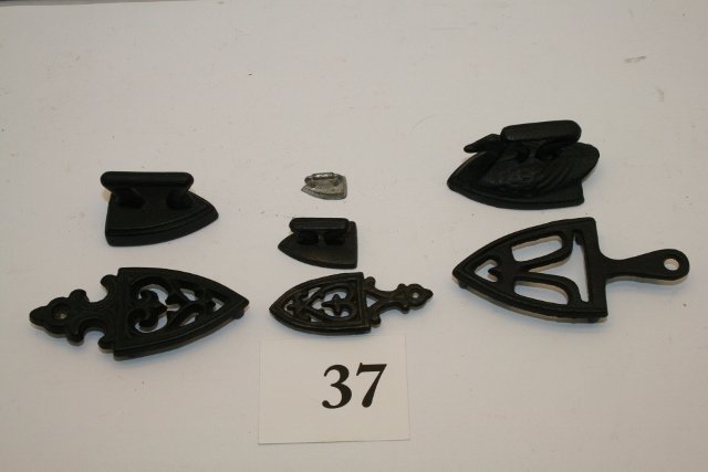 (4) Sad Irons & 3 Trivets: (4) Sad Irons & 3 Trivets – one nice swan sad iron – largest – trivet 3 ¼”