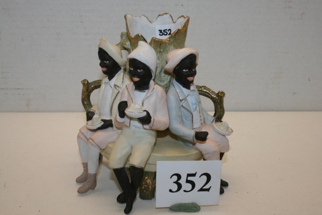 Bisque Black People sitting on bench: Bisque Black People sitting on bench eating around tree stump – unmarked 5 ½” tall