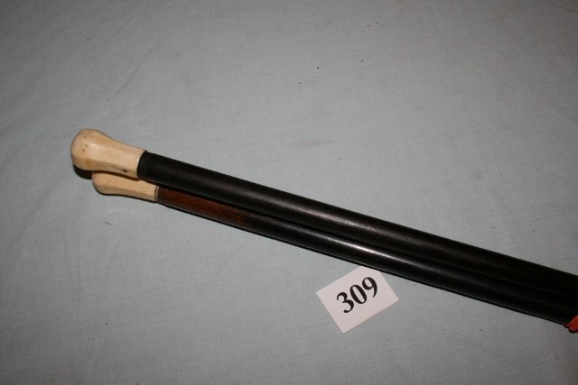 Pair Ivory Handled Ebony Canes: Pair 35 ¼” Ivory Handled Ebony Colored Canes