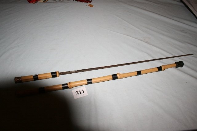 Bamboo Sword Cane: 33” OAL Bamboo Sword Cane with gold washed cap handle 2 pc. has bands of electrician tape reinforcing bamboo from separating