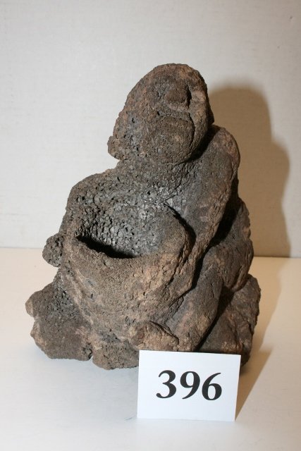 Carved Figure Seated Man: 6 ¼” x 7 3/8” Carved Figure Seated Man out of Lava Rock – unusual form