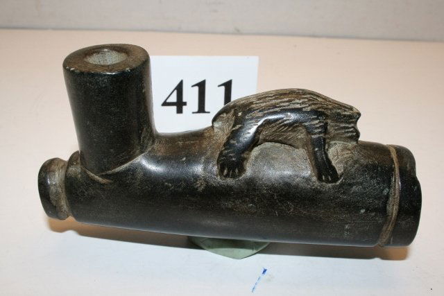 Black Polished Steatite Bear Pipe: 4 3/8” x 2 1/8” Black Polished Steatite Bear Laying down “possibly in death” Pipe