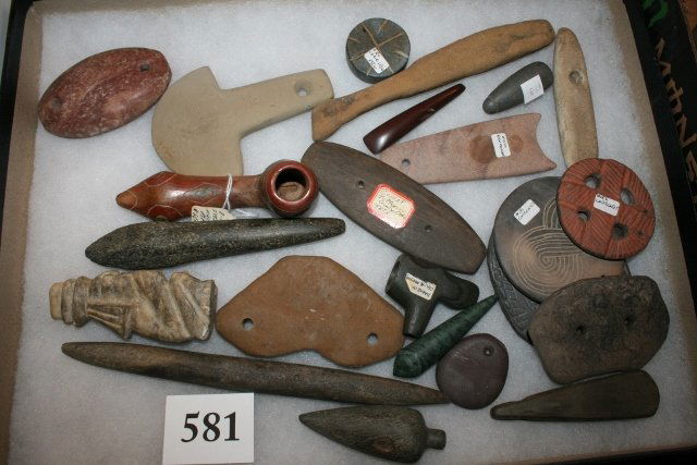 23 assorted cont repro “Artifacts”: Box containing 23 assorted contemporary reproduction “Artifacts” including Pipes, gorgets, pendants etc..