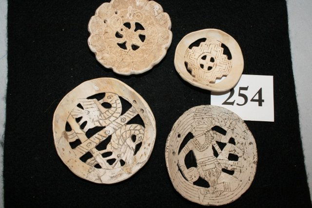 (4) Finely Carved Shell Gorgets: (4) Finely Carved Shell Gorgets, prehistoric designs, cut out and engraved, largest 3 1/8” – age uncertain