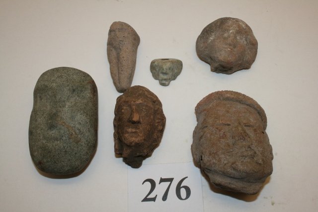 6 South American Artifacts: Lot consisting of 6 interesting South American Artifacts including 3 Clay Human Heads, one appears to be oriental, clay rabbit head effigy, green stone pendant with human face, and a small Jadite Pend