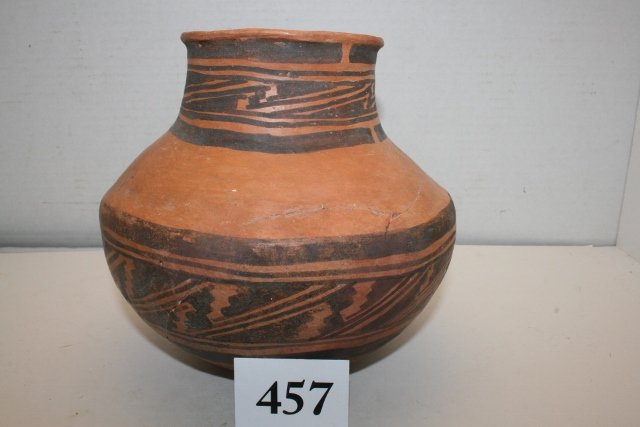 Jeditto Black on Orange: 7 ½” x 6 ½” Jeditto Black on Orange, Cracked, glued Jar found Witch Wells, Arizona