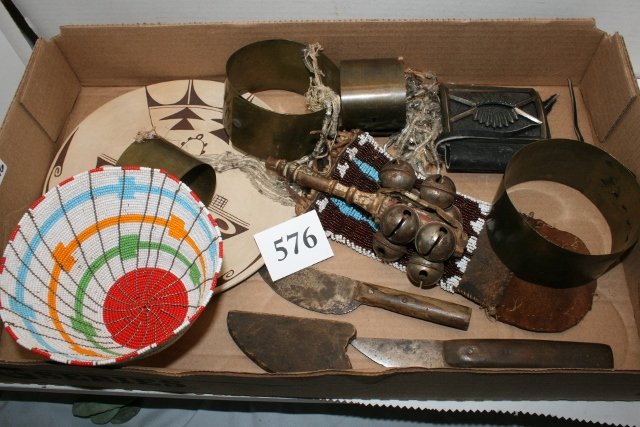 4 Copper Bracelets: Lot consisting of 4 Copper Bracelets, Wire Basket, Bell Rattle, Hopi Plate, Strike-a-lite, 2 Tobacco Knives, One with wood sheath, 2 Strings Beads, Navajo Ketoh