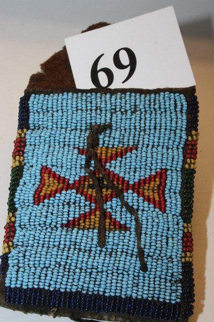 Beaded Rations Pouch: 5 ½” x 3” Beaded Rations Pouch – circa 1890’s, originally had tin cones attached, one attached, 3 inside from the Tim Ponstingle Coll.