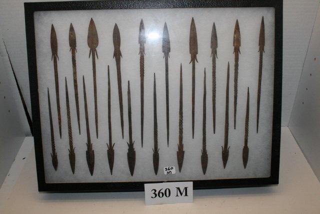 20 Iron Rat Tailed Arrow Points: 12 x 16 Frame containing 20 Iron Rat Tailed Arrow Points or darts, Indonesian