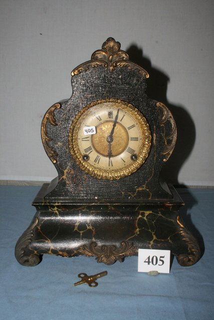 14 ¾” Tall “Alexander” Striking Clock by W.H. Gilbert: 14 ¾” Tall “Alexander” Striking Clock by W.H. Gilbert Co. original Black Marbelized paint – piece on back missing – key – no pendulum
