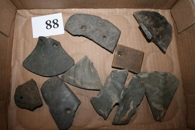 9 Broken Segments of Slate Pendants: Lot Consisting of 9 Broken Segments of Slate Pendants, Gorgets, Bannerstones etc…. some have drilled holes for repair by the Indians, all found in Michigan – Largest 3 1/8” x 2 ½” nice study