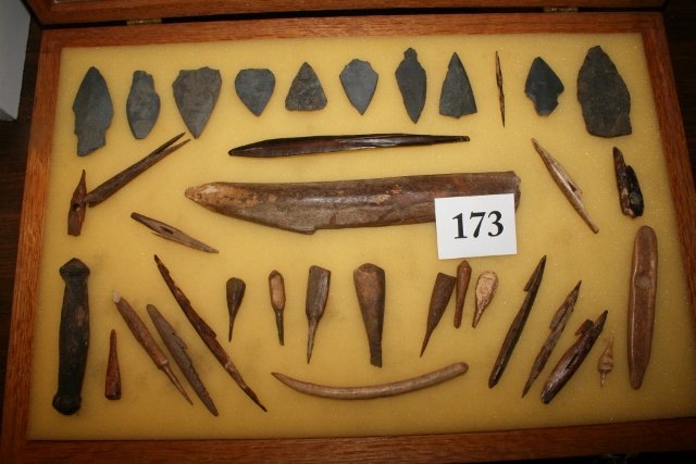 10 slate points bone and walrus ivory artifacts -: 12 x 15 Wood Frame containing 10 slate points fossilized bone and walrus ivory artifacts, Alaska Eskimo, Nice Assortment in fine display case, - largest is 8 ½” - WILL NOT SHIP OUT OF COUNTRY