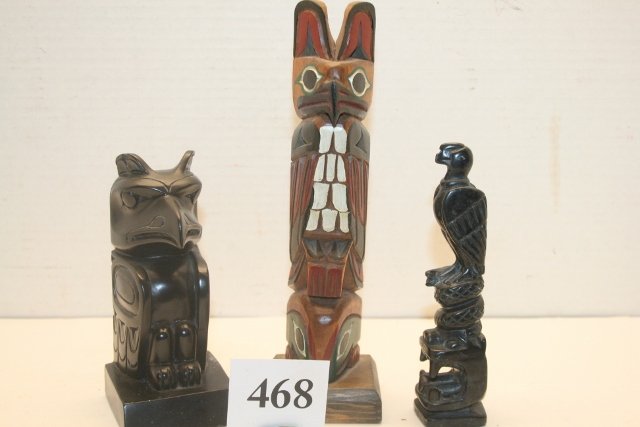 3 Totem Poles: Lot consisting of 3 Totem Poles, one is a rare carved argelite pole 6” long, one is 5 ½” cast pole and one is a 8 ¾” carved Cedar Pole signed H. Rydick, Nice Lot