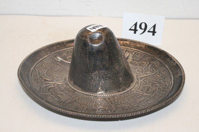 Mexican Sombrero: 6 5/8” Diameter Finely Executed Mexican Sombrero of Sterling Silver, 136 Grams, has the Aztec Calendar Stone as well as other designs on the entire surface – nice