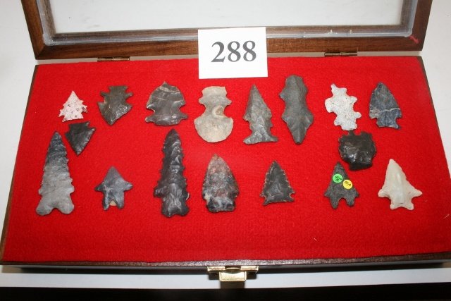 17 Fine Exotic Flint Points: 6 x 12 Wood Display containing 17 Fine Exotic Flint Points and Rare Example from Archie Diller Collection – Largest 2 5/16” – Nice Group