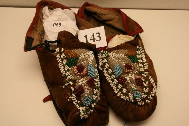 Pair Mohawk – Tuscarawas Moccasins: 10” Pair Mohawk – Tuscarawas Moccasins – circa 1870’s, some bead loss, resoled marked Bruesser & Co. Costumers Detroit, Michigan