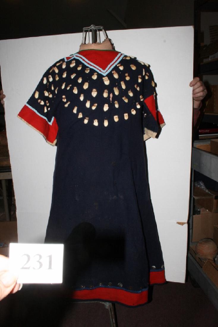 Crow Bead and Elk Tooth Decorated Dress: 43” x 24” Crow Bead and Elk Tooth Decorated Dress - many moth holes on both sides - stitched repair to tears - patch on one side - poor condition