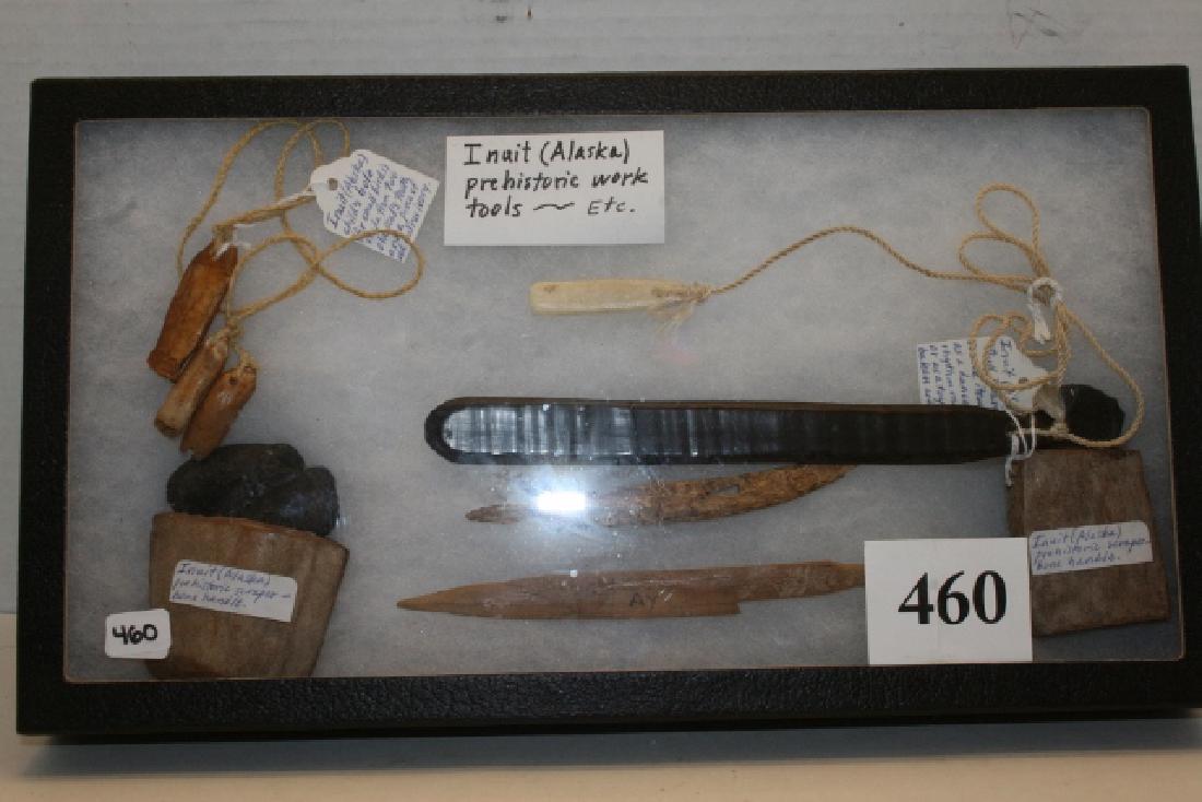 2 Hafted Bone Handled Scrapers: 8” x 14 ½” Frame containing 2 Hafted Bone Handled Scrapers, Child’s Bird Bola, Harpoon Point, Bone Arrows, 2 piece Bull Roar