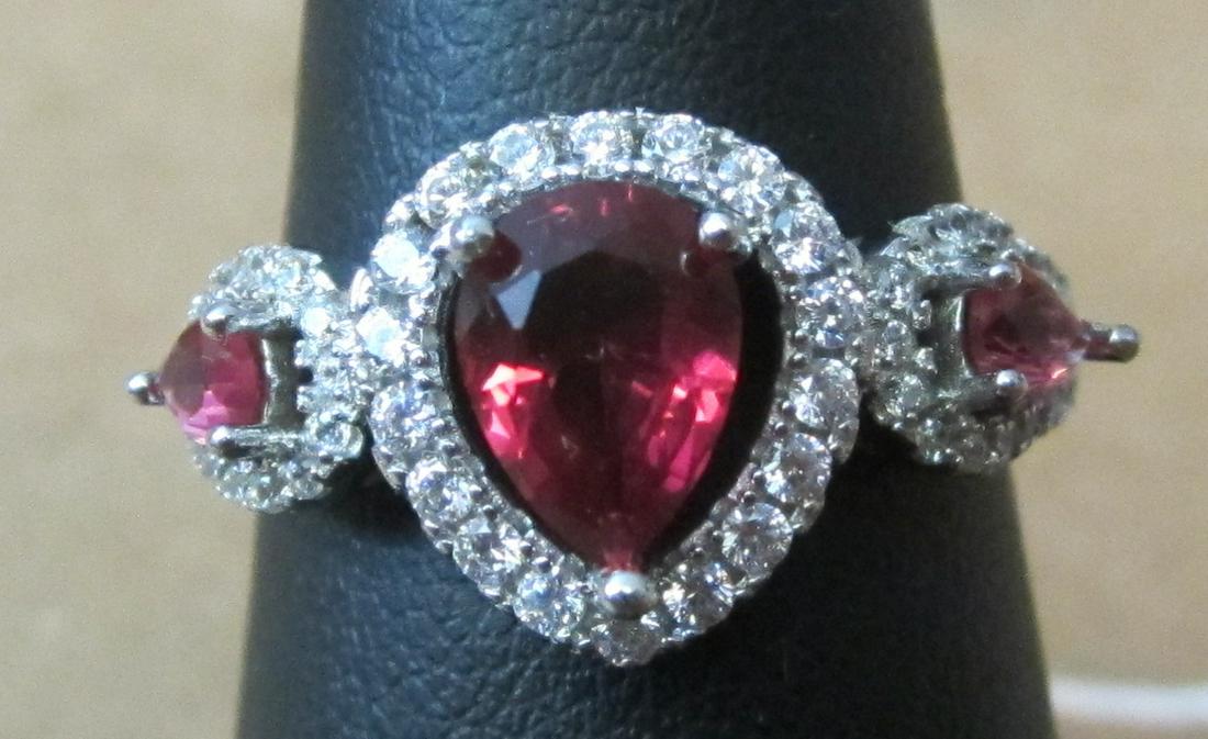 2 ctw. lab ruby and white topaz sterling ring: Fancy 2 ctw. lab ruby and white topaz filigree sterling ring. Marked 925. Size 8.5