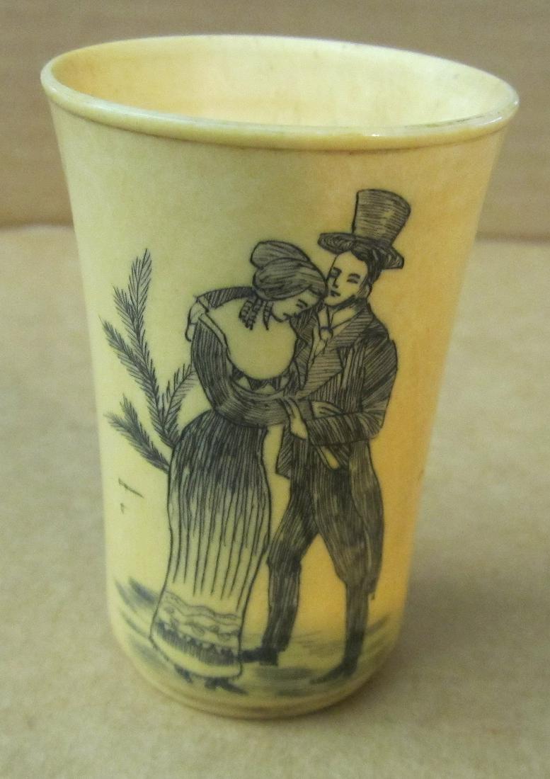 Scrimshaw shot cup made from horn: Scrimshaw shot cup made from horn. Of Victorian couple. Measures 2 1/2 inches tall. Good Condition, no chips, no cracks, no repairs - thriftiques attempts to call any flaw that can affect the value of