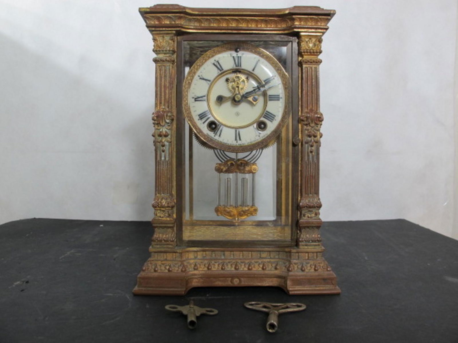 Fancy Ansonia Heavily decorated regulator clock with: Fancy Ansonia Heavily decorated chrystal palace regulator clock with open escapement.In good original as found condition. with great colors and detail. Measures 11.5 inches tall. 7.5 inches wide.