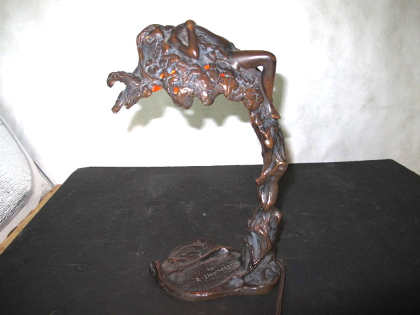 Art mouveau Bronze table lamp with nude reclineing: Art mouveau Bronze table lamp with nude reclineing woman. In good original as found condition. with great colors and detail. Measures 13 inches tall. 6 inches wide.