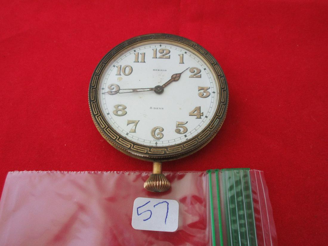 Unusual Herald automobile antique clock. 15 jewel.: Unusual Herald automobile antique clock. 15 jewel. Works marked Herald WH Co. Swiss. No serial number. Case measures 2 1/2". Not running.