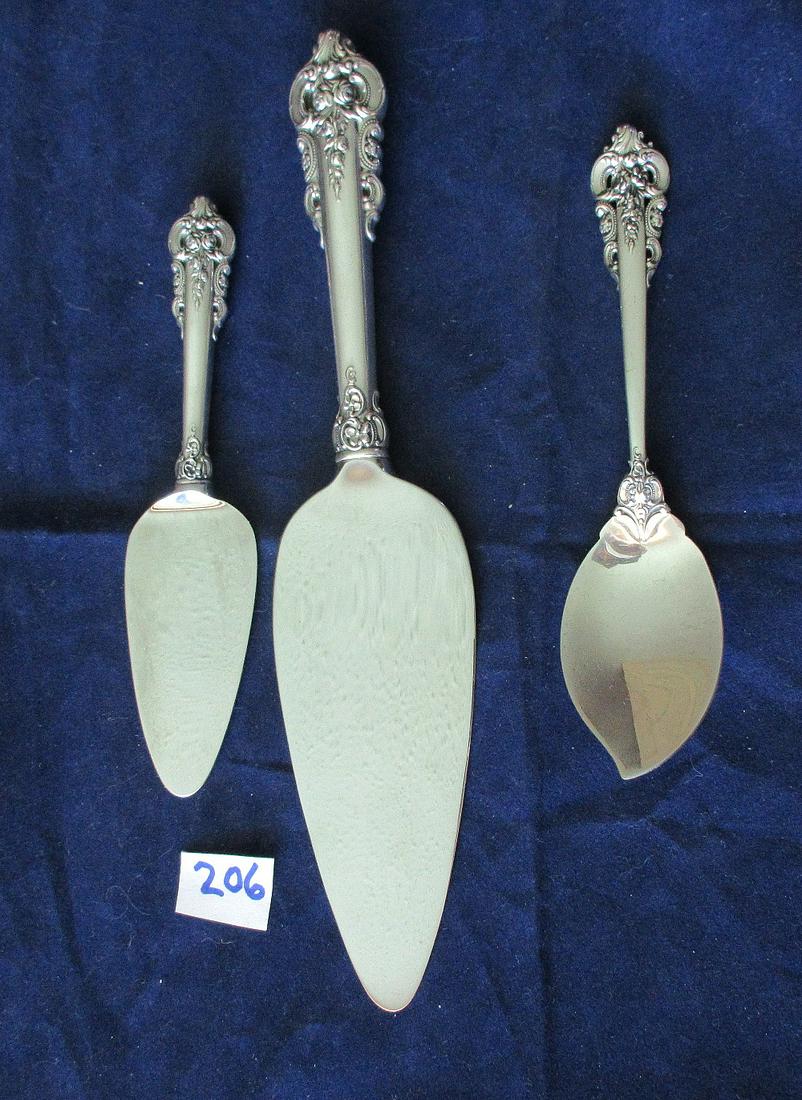 3 Walace Grande Baroque sterling handle serving pieces.: 3 Walace Grande Baroque sterling handle serving pieces. Largest measures. 10 1/4 ".
