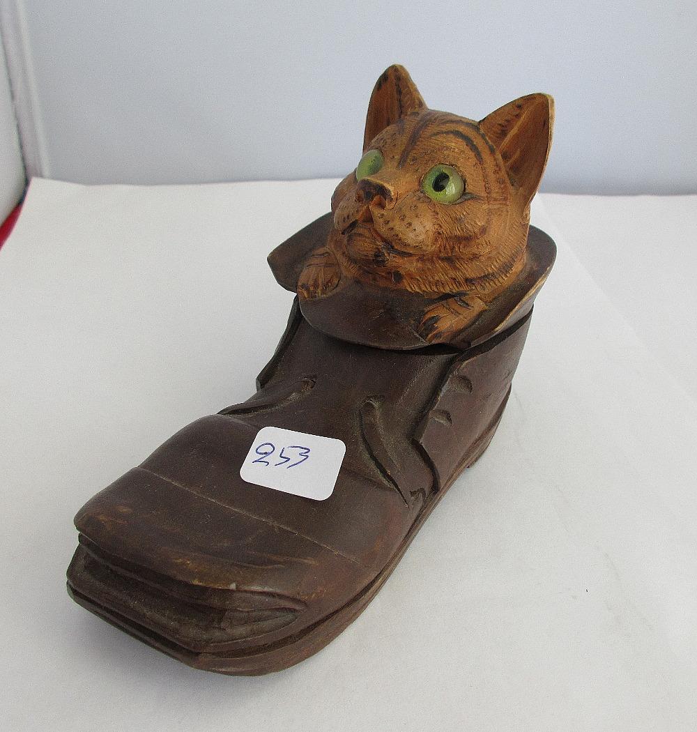Antique black forest hand carved cat in shoe ink well: Antique black forest hand carved cat in shoe ink well. Measures 3 ½” tall and 5 ¼" long.