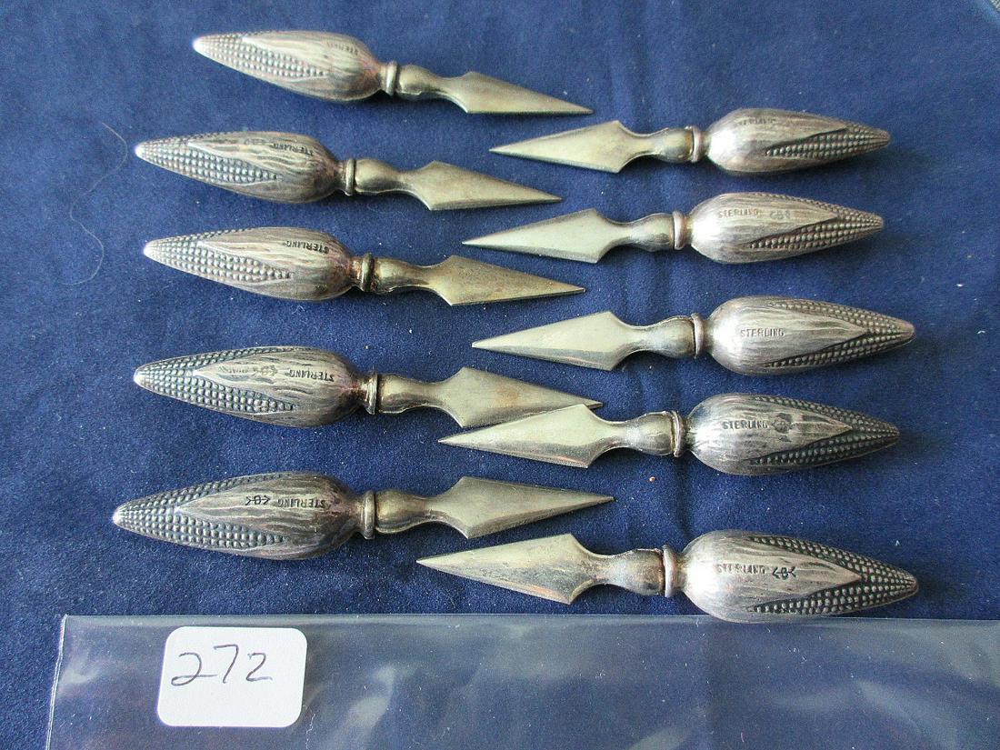 Ten sterling silver sweet corn on the cob holders: Ten sterling silver sweet corn on the cob holders. Approx. 94 grams. Measures 2 7/8".