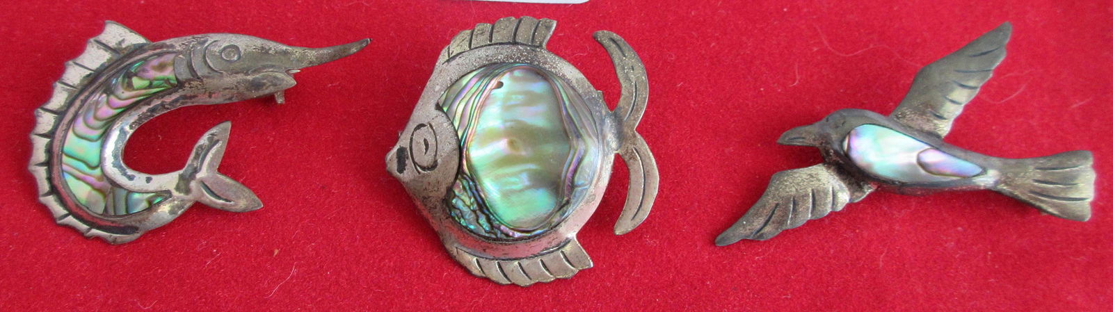 3 abalone inlaid sterling pins marked on back. Please: 3 abalone inlaid sterling pins marked on back. Please see photo for size.
