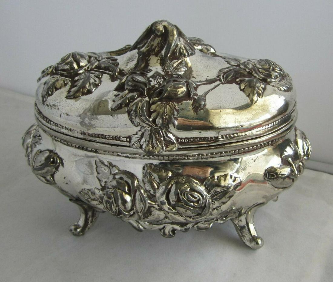 ANTIQUE ART NOUVEAU METAL JEWLERY BOX WITH FLOWERS: ANTIQUE ART NOUVEAU METAL JEWLERY BOX WITH FLOWERS IN GOOD ORIGINAL CONDITION AS SHOWN IN PHOTOS. MEASURES 3 1/4 INCHES TALL AND 4 1/2 INCHES ACROSS. Marked Rogers