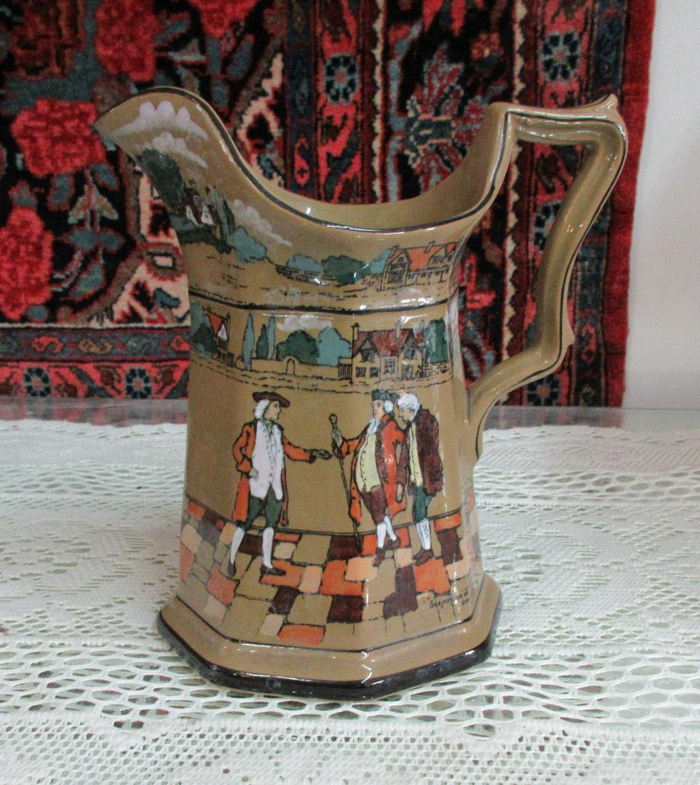Signed Buffalo pottery pitcher: Signed Buffalo pottery pitcher with beautiful colors and great detail. 7 ¼ inches tall.