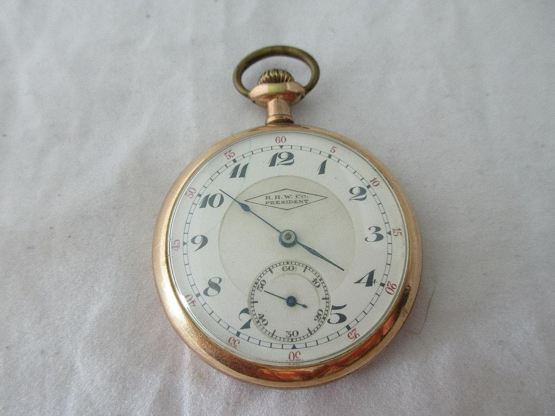 Antique H.H. W. Co. President Swiss 17 jewel gold: Antique H.H. W. Co. President Swiss 17 jewel gold filled pocket watch. Decoration on back of case. Porcelain dial. In running condition. Case measures 1 3/8” Serial number as shown in photo. Please 