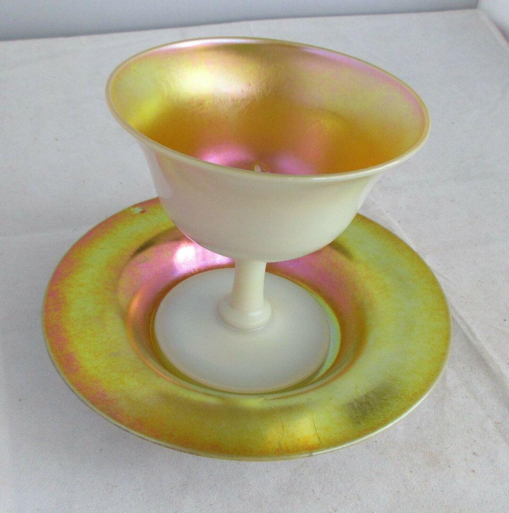 BEAUTIFUL STEUBEN IRIDESCENT AUREEN AND CALCITE ART: BEAUTIFUL STEUBEN IRIDESCENT AUREEN AND CALCITE ART GLASS SHERBERT AND UNDER PLATE. IN GOOD ORIGINAL CONDITION, AS SHOWN IN PHOTOS. BOWL SMALL AIR BUBLE IN MAKING AS SHOWN IN PHOTO. UNSIGNED AS MOST C