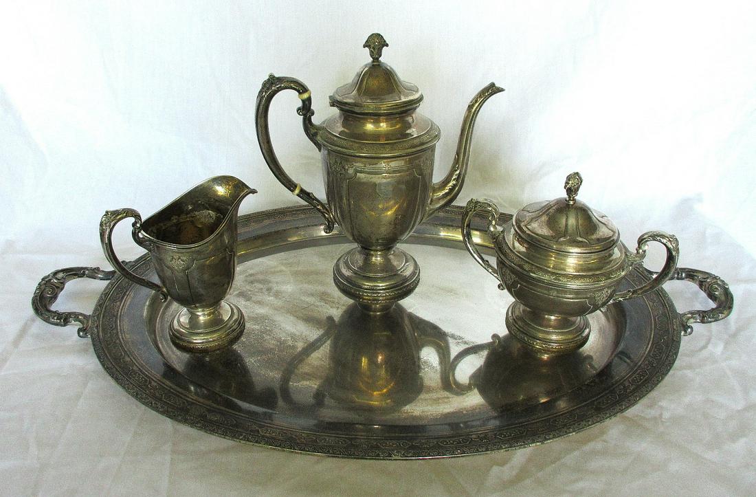 Louis the 14th Towle sterling tea set. With great: Louis the 14th Towle sterling tea set. With great quality and detail. Needs polished. Tea pot Measures 10 ½ inches and tray is 27 ¼ inches weighs Approximately 137 oz