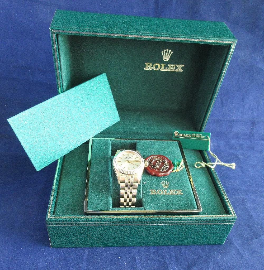 116 Special Ladies 14k gold Rolex Oyster Perpetual: 116 Special Ladies 14k gold Rolex Oyster Perpetual watch in original box and tag. 29 jewel. Swim proof. Beautiful colors and great quality and detail. Marked 585 on band. Weighs 56 grams. Running.