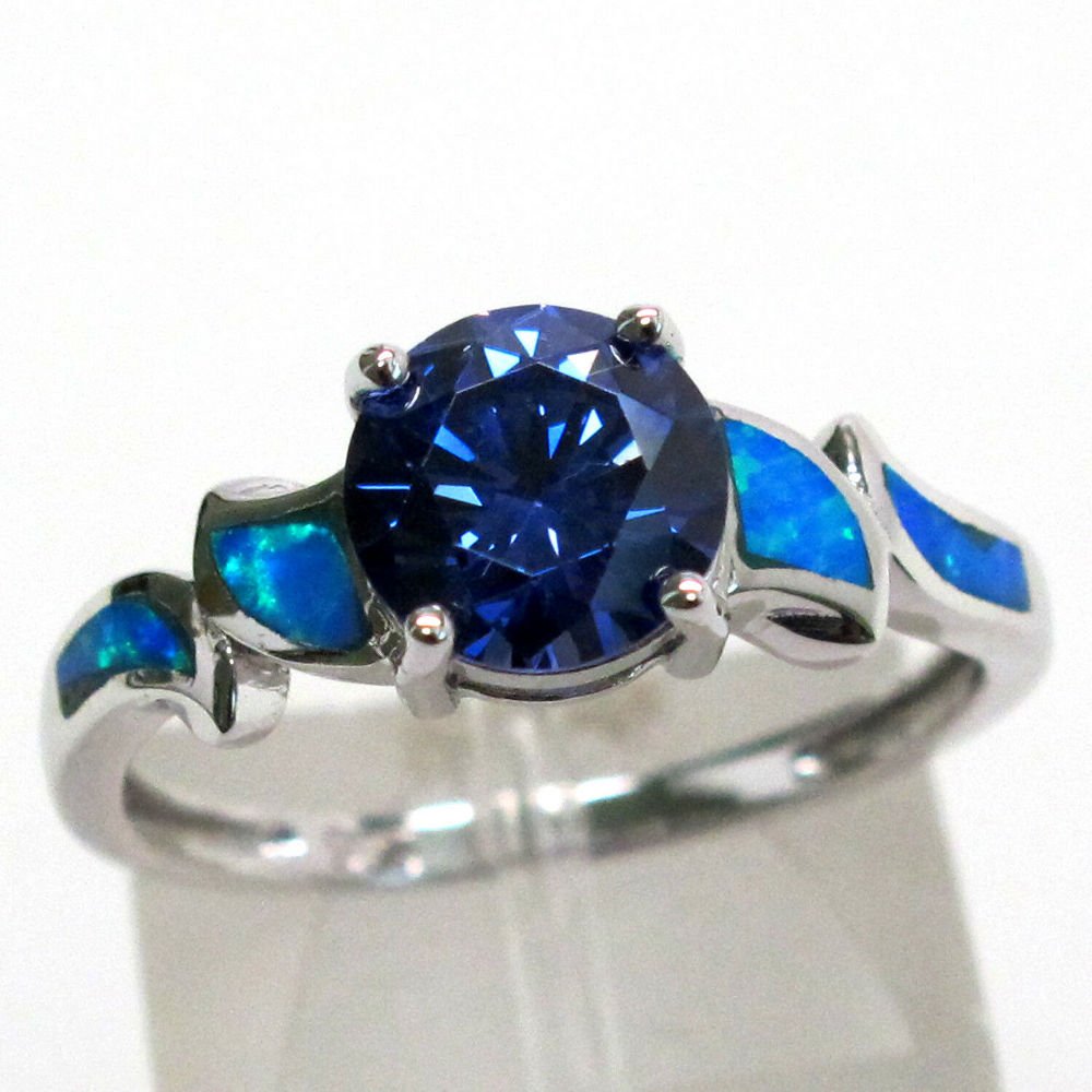 1.5 CT TANZANITE BLUE OPAL 925 STERLING SILVER RING: 1.5 CT TANZANITE BLUE OPAL 925 STERLING SILVER RING In good original as found condition. Beautiful colors with great quality and detail.