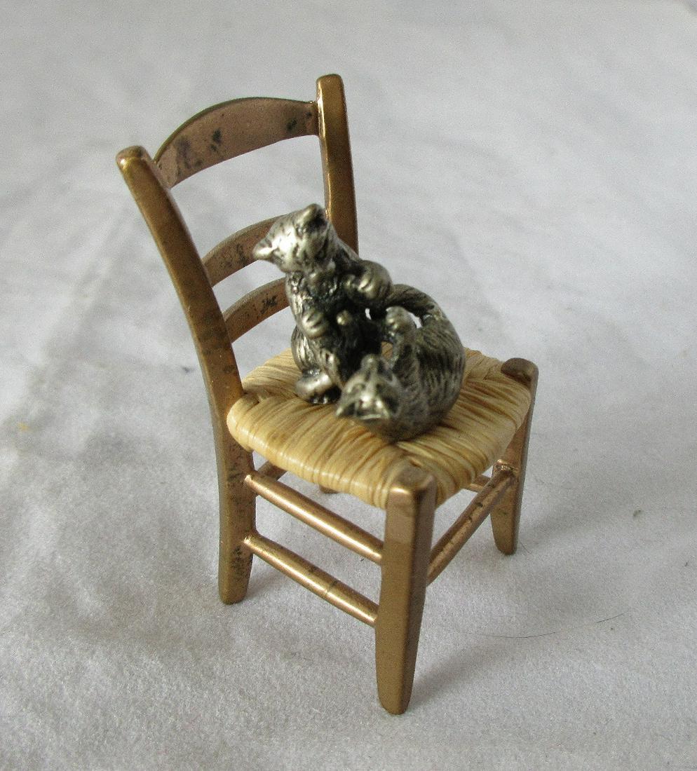 Neat antique 800 silver cats fighting in bronze chair.: Neat antique 800 silver cats fighting in bronze chair. In good original as found condition. Beautiful colors with great quality and detail. Measures 1 ¾ inches tall.