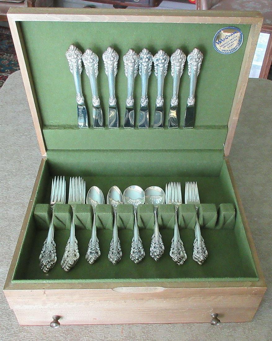 Elegant Grande Baroque 8 place sterling flatware set: Elegant Grande Baroque 8 place sterling flatware set. In good original as found condition with great quality and detail. Knives are 9 inches, forks are 7 3/8 inches, and salad forks are 6 3/8 inches. 