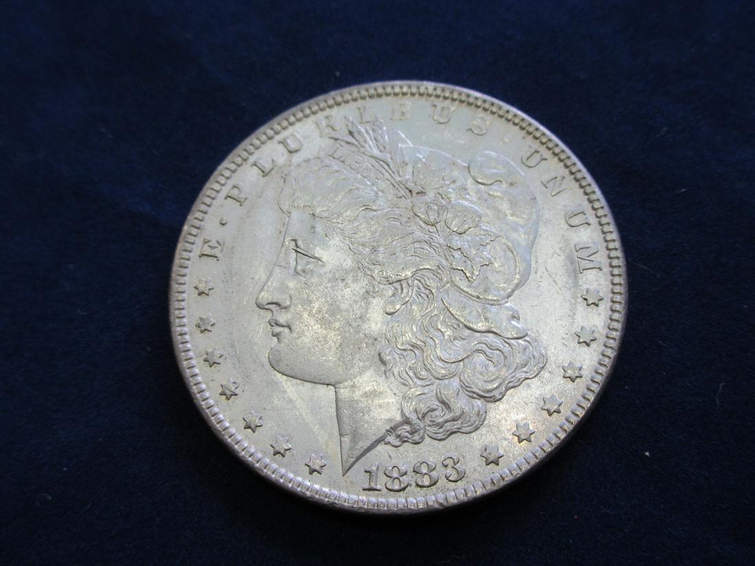 1883 uncirculated Morgan silver dollar: 1883 uncirculated Morgan silver dollar. Please use photos to grade for yourself.