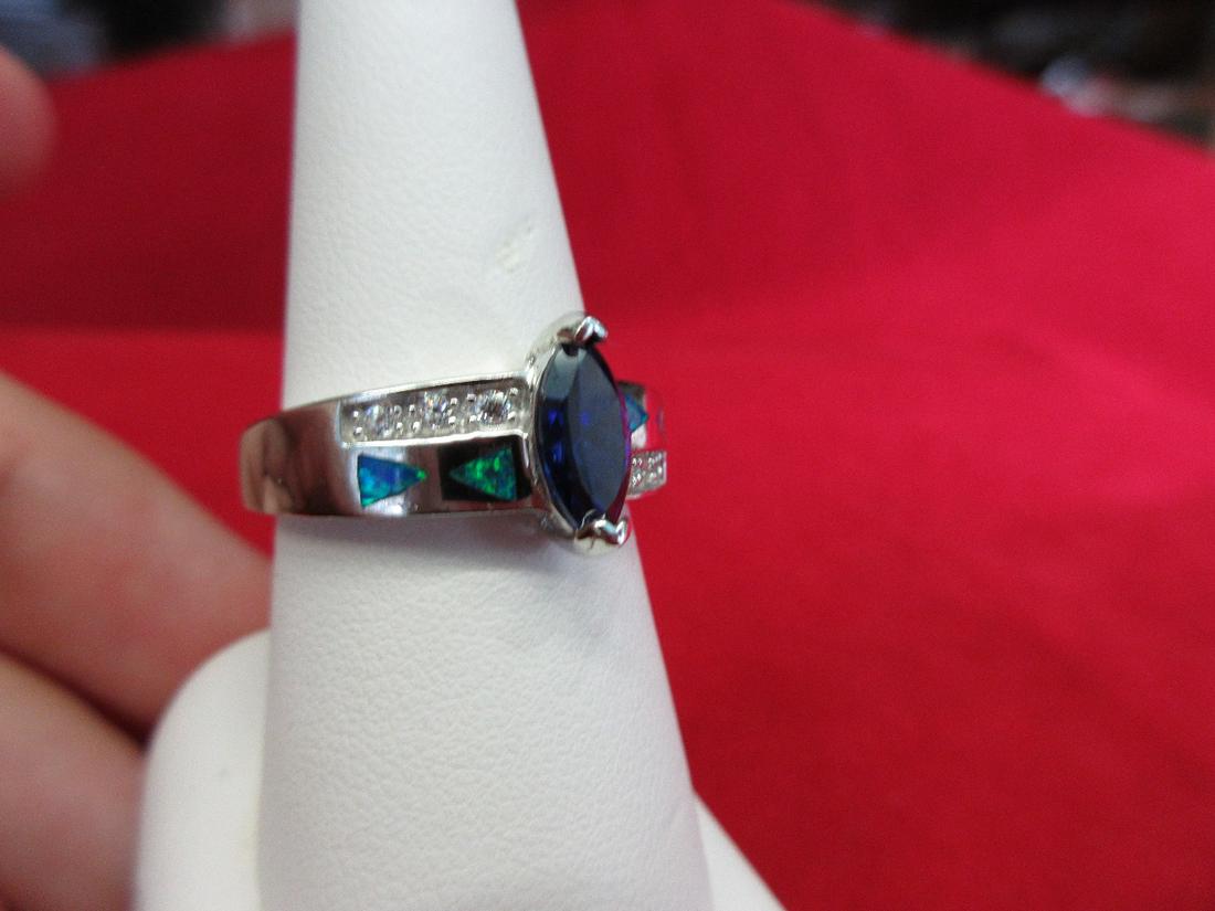 Beautiful approx. 1 ct. Tanzanite & blue opal sterling: Beautiful approx. 1 ct. Tanzanite & blue opal sterling ring. Size 9. Lab created.