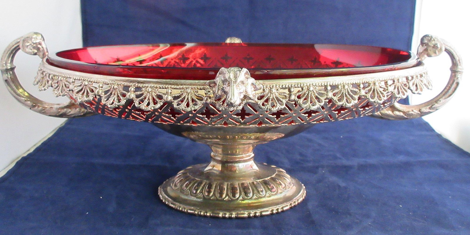 Fancy Victorian cranberry art glass centerpiece: Fancy Victorian cranberry art glass centerpiece. Fancy silver-plate frame signed as shown. 13 ½ long and 9 ¾ wide and 5 inches tall. In good original as found condition. Beautiful colors