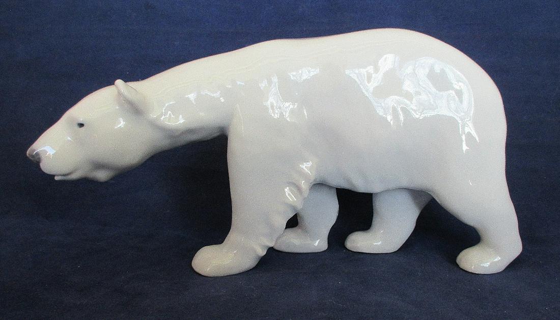 Royal Copenhagen porcelain figure of Polar Bear: Royal Copenhagen porcelain figure of Polar Bear. 3 3/4" t. x 7" long. In good as found condition with beautiful colors and great quality and detail.