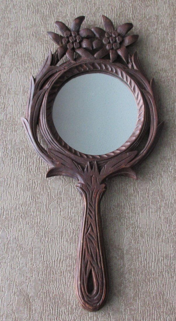 Antique carved black forest hand mirror.: Antique carved black forest hand mirror. Approx. 11 3/4 inch's long. In good original as found condition. Beautiful colors with great quality and detail