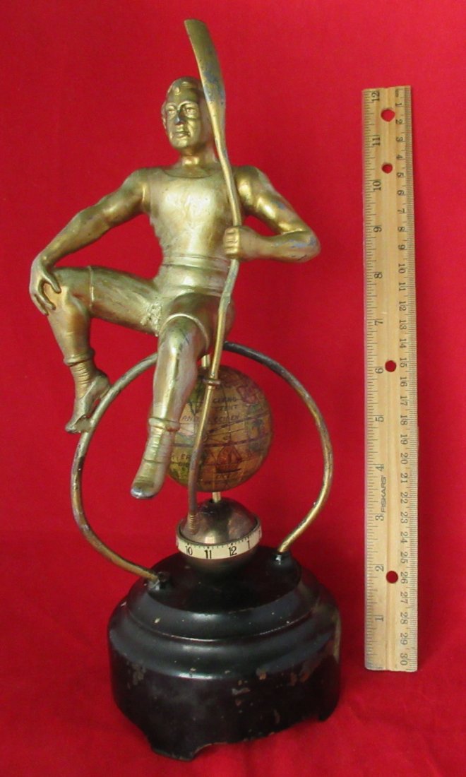 Rare Antique anular world figural clock. running: Rare Antique anular world figural clock. running. Clock rotates and world above rotates at different speed to show the time in that part of the world. In good original as found condition. Figure on to