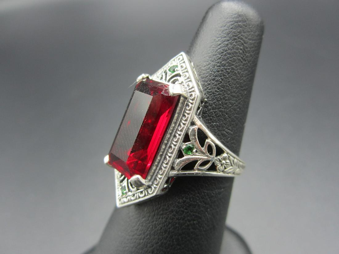 Beautiful approximate 12 ct. ruby & emerald and: Beautiful approximate 12 ct. ruby & emerald and sterling ring. Size 8. Lab created In good original as found condition. Beautiful colors with great quality and detail.