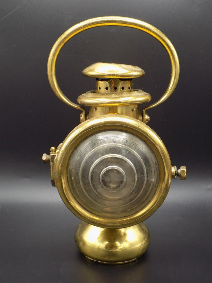 High end Antique 1909 brass automobile lamp: High end Antique 1909 brass automobile lamp. IN GOOD ORIGINAL AS FOUND CONDITION WITH DENT IN TOP. Beautiful colors with Great quality and detail. Measures 9 inches long and 2 3/8 inches wide. Measure