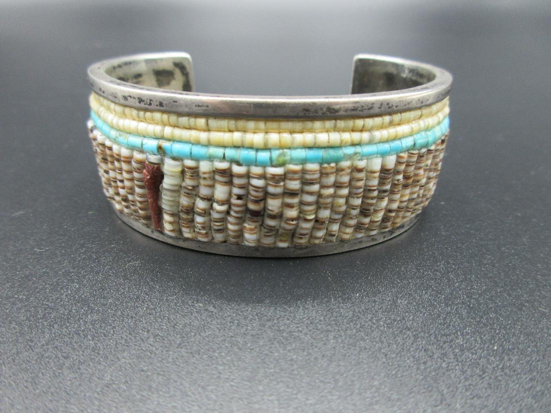 Artist signed Vintage Native American Indian bracelet: Artist signed Vintage Native American Indian bracelet. All Indian jewelry is sterling, Tested and guaranteed. Turquois, and multi colored stone beads IN GOOD ORIGINAL AS FOUND CONDITION. Beautiful col
