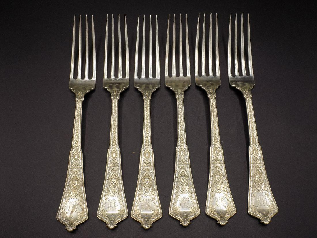 Exquisite set 6 Signed Tiffany sterling forks: Exquisite set 6 Signed Tiffany sterling forks. Dated 1878. Monograms, Measure 7 1/8 inches and weigh 274 gm. IN GOOD ORIGINAL AS FOUND CONDITION. Beautiful colors with Great quality and detail. 8.8 oz
